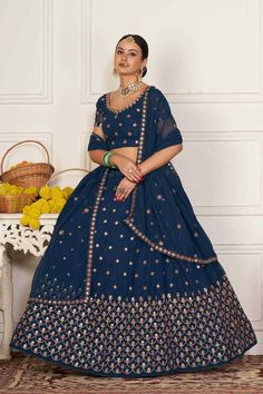 color-turquoise, fabric-georgette, work-embroidered, brand-name-krupali-savani,occasion-festivewear, occasion-wedding-guest, womenswear,ideal-for-women, lehengas, Product Features: Color: Teal Lehenga Fabric: Georgette Choli Fabric: Georgette Work: Embroidered Sleeves: Short Sleeves Neck Type: Round Neck Wash Care: Dry Clean Occasion: Festivewear, Wedding Guest Product Type: Lehenga Choli with Dupatta Disclaimer: There will be slight difference in digital to actual image Blue Georgette Sharara For Reception, Blue Chinon Sharara With Cutdana Detail, Blue Georgette Sharara With Pallu, Turquoise Zari Work Dress, Blue Georgette Lehenga With Intricate Embroidery, Blue Chinon Anarkali Set For Reception, Turquoise Sharara For Wedding, Festive Turquoise Sharara, Blue Embroidered Lehenga In Georgette