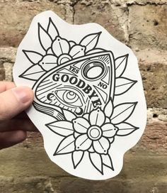 someone holding up a sticker with the words good bye on it and an image of a fish