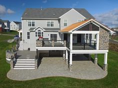 an aerial view of a house with a deck and patio