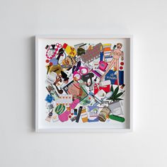 a white framed artwork with many different things on it's surface, including shoes and other items