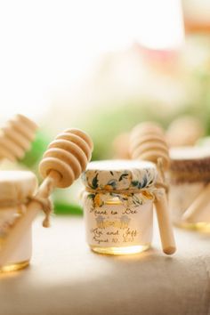 some honey jars are sitting on a table