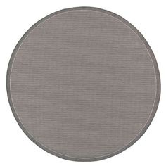 a round gray rug on a white background