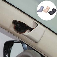 a car door handle with two pairs of sunglasses on it