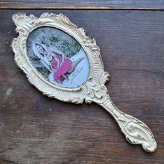 Oval Frame Area Holds One 6x4" Photo. Overall Item Length 14" Store Sticker Says Pewter But It Doesn't Look It To Me. I Don't Know. Item Weight 1lb Ornate Hand Mirror, Mirror Oval, Mirror Photo Frames, Mirror Photo, Hand Mirror, Metal Hand, Oval Frame, Metal Casting, Photo Frame