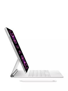 an open laptop computer sitting on top of a white desk