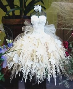 a dress made out of fake flowers is displayed on an instagram page for the flower bride