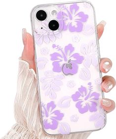 a woman's hand holding an iphone case with purple flowers on white and lavender