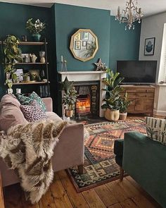 a living room filled with furniture and a fire place in the middle of the room