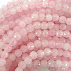 pink beads with white speckles on them