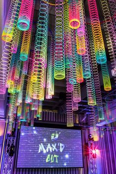 a room filled with lots of neon colored lights