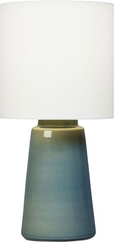 a blue table lamp with a white shade on the top and bottom part of it