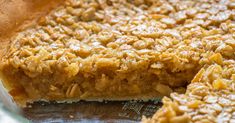 a close up of a pie with some oats on it