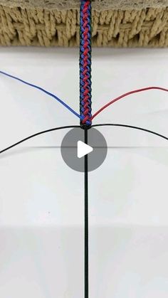 a video demonstrating how to tie a rope around a piece of cloth with two different colors