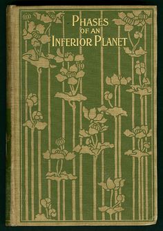 an old green book with flowers and plants on the front cover, which reads phases of an interior plant