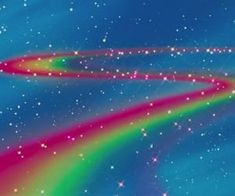 an image of a rainbow colored object in the sky with stars and sparkles on it