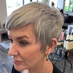 Pixie hairstyles for older women offering chic and youthful short cuts. Explore textured pixie designs, layered short styles, and mature pixie variations. Discover pixie haircut ideas featuring side-swept bangs, spiky tops, and elegant gray pixies. Find inspiration for low-maintenance pixie cuts, voluminous short styles, and age-defying pixie looks. Get styled with these flattering short hairstyles perfect for older women seeking a modern and confident appearance. Stylish Pixie Haircut, Natural White Hair, Pixie Haircut Fine Hair, Pixie Haircuts For Women, Edgy Short Haircuts, Wedge Haircut