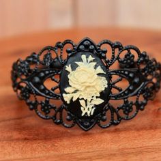 About This Item Black Filigree Cuff With Flower Cameo. The Cuff Is Copper Coated With Cabochon. This Cuff Is Flexible And Fits Most Wrists. Very Detailed Design And Such An Eye-Catching Piece! This Wearable Art Piece Can Be A Special Gift To Yourself Or Use As A Lovely Gift To Someone Else. Look At Our Other Jewelry To Make This Into A Set! Vintage Black Cuff Bracelet As Gift, Vintage Black Bangle Cuff Bracelet, 50s Jewelry, Jewelry To Make, Snowflake Bracelet, Feather Bracelet, Black Leather Bracelet, Tassel Bracelet, Handcrafted Bracelets