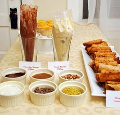 there are many desserts on the table ready to be eaten at this party or celebration