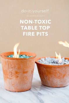 two clay pots filled with fire pits on top of a marble counter next to the words, do - it - yourself non - tonic table top fire pits