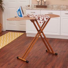 an ironing board on top of a wooden table