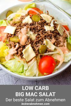 a salad with meat and cheese in a white bowl