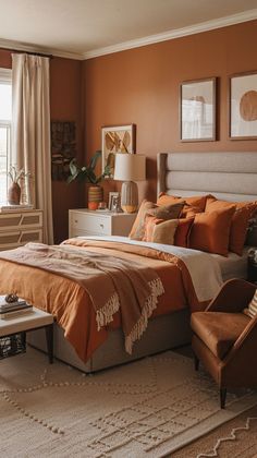 a bedroom with an orange and white color scheme, including a bed in the center