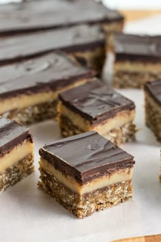 several pieces of cake sitting on top of a table