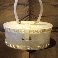 This Vintage Wilardy Lucite Box Purse Is A Stunning Piece From The 1950s. With Its Unique White Color And Original Design, It Is Sure To Make A Statement As A Special Occasion Accessory. The Durable Lucite Material Adds To Its Vintage Charm And The Purse Is In Excellent Condition For Its Age. Perfect For Any Woman Who Loves To Add A Touch Of Vintage Style To Their Wardrobe. There Is A Very Slight Amount Of Crazing On The Top Lid Where The Handle Connects To The Actual Purse. It Has A Little Oran Pearl White Color, Box Purse, Vintage Purses, The 1950s, Women Accessories Bags, Vintage 1950s, Vintage Charms, American Vintage, Pearl White