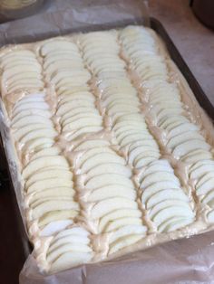 a pan filled with bananas sitting on top of a table