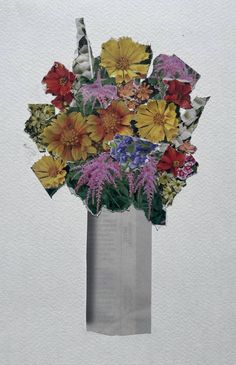 a vase filled with lots of different colored flowers