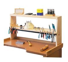 a wooden workbench with various tools on it