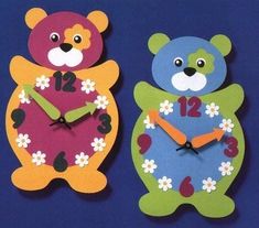 two colorful teddy bears are standing next to each other in front of a blue background