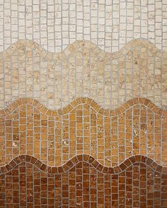 an image of a tiled wall that looks like waves in the sea or ocean with brown and white colors