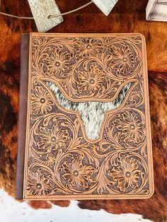 a cowhide cover with an animal's head in the center on a cow hide