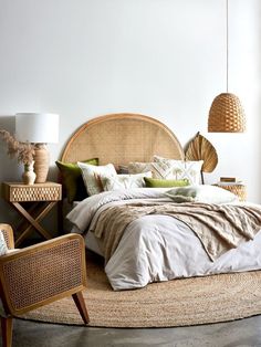 a bedroom with wicker furniture and white walls