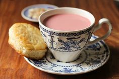 a cup of tea and biscuits on a saucer