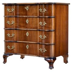 an antique chest of drawers with brass hardware