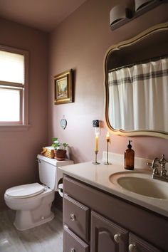 Bathroom vanity makeover in mauve color and cream counter Mauve Paint, Mauve Bathroom, Mauve Paint Colors, How To Install Baseboards, Easy Bathroom Updates, Mauve Walls, Toilet Handle, Big Baths, Bathroom Vanity Makeover