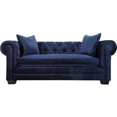 a blue couch sitting on top of a white floor