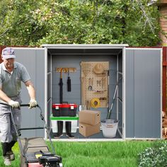 a man with a lawn mower in front of a storage shed filled with tools