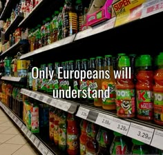 a grocery store aisle filled with lots of different types of drinks and condiments