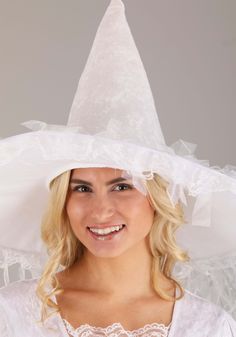 a woman wearing a white witches hat