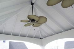 the ceiling fan is hanging from the ceiling in the room with white walls and ceilings