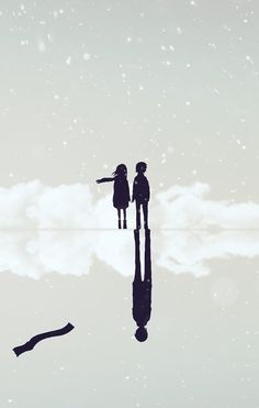 two people are standing in the water with their arms around each other as they look up into the sky