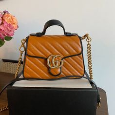 Never Used - Purchased From A Consignment Store And Has Authentication Card (See Pictures) Dimensions: * Height: 6" *Width: 8" *Depth: 3" *Shoulder Strap Drop: 21.25" * Handle Drop: 1.75" Gucci Shoulder Bag By Alessandro Michele Orange/Brown Leather Double G Logo Gold-Tone Hardware Single Shoulder Strap Chain-Link Accents Microfiber Lining & Single Interior Pocket Push-Lock Closure At Front Designer Orange Top Handle Shoulder Bag, Luxury Orange Bag With Gold-tone Hardware, Luxury Orange Evening Bag, Luxury Orange Evening Bags, Designer Orange Bags With Gold-tone Hardware, Luxury Orange Shoulder Bag For Shopping, Double G Logo, G Logo, Gucci Marmont