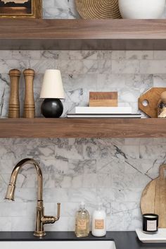 the shelves above the kitchen sink are filled with various items that include soap and toothbrushes