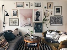 a living room filled with lots of furniture and pictures on the wall above it's coffee table