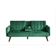 a green couch sitting on top of a wooden floor