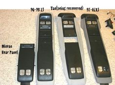 three remote controls sitting on the floor next to each other