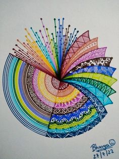 an artistic drawing with colored lines and colors in the shape of a flower on white paper